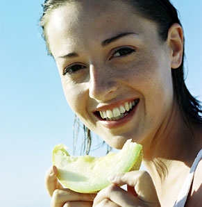 Woman eating fruit